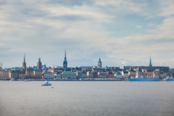 Obraz premium Beautiful super wide-angle panoramic aerial view of Stockholm, Sweden with harbor and skyline with scenery beyond the city, seen from the observation tower, sunny summer day with blue sky 