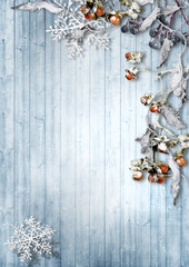 Vintage winter background with snowy branches and berries