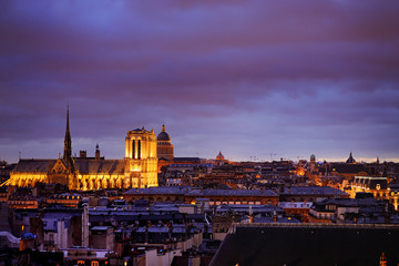 Dramatic view of Paris roofs in dusk