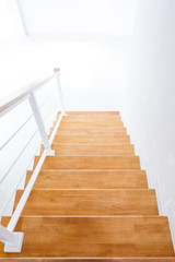 The modern wooden stair way in home close up.