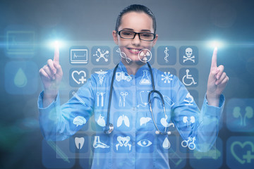 Woman doctor pressing buttons with various medical icons