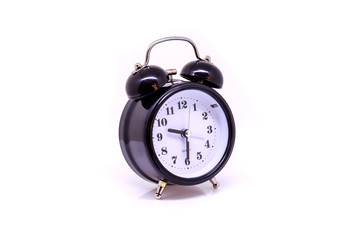 Black alarm clock isolated on white background.