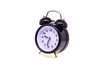 Black alarm clock isolated on white background.