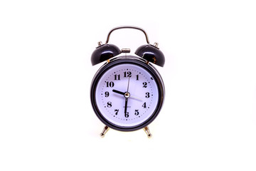 Black alarm clock isolated on white background.