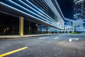 clean asphalt road through office block area,suzhou,china.