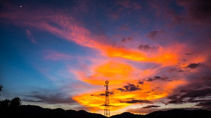 Fototapeta na wymiar Silhouettes telecommunication tower at sunset