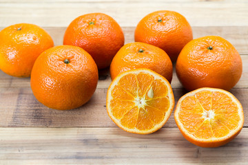 Fresh oranges on wooden background.