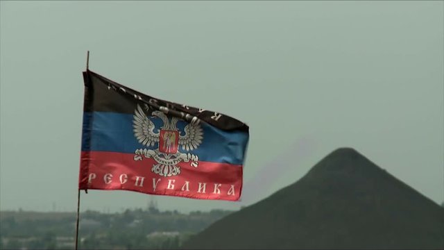 Flag of Donetsk People's Republic of growing in the wind