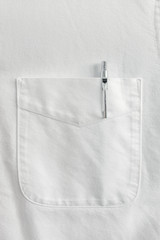 Close up pen in pocket on white shirt