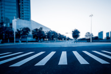 clean asphalt road through office block area,suzhou,china.