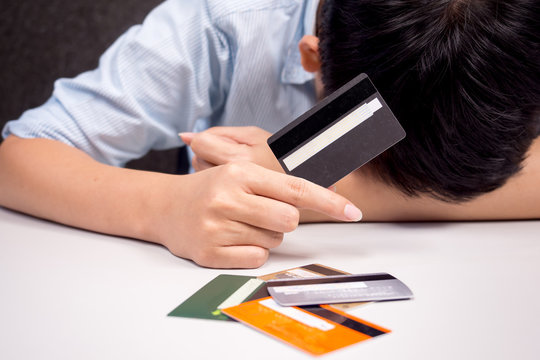 holding a credit card - debt with spending