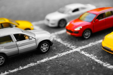 Fototapeta premium Close up of toy cars parking