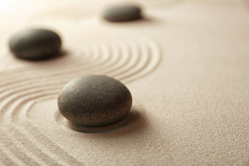 Fototapeta na wymiar Japanese Zen garden. Pebbles on a sand