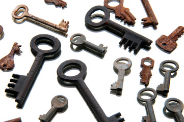 Old rusty keys on white background. Mirror