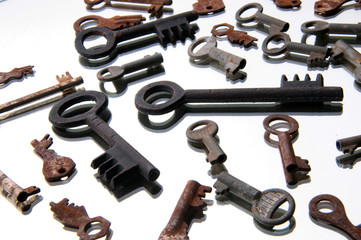 Old rusty keys on white background. Mirror