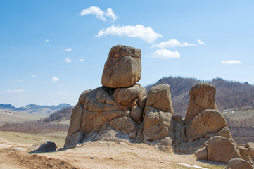 bright blue sky over the rocks, mountain-like turtle