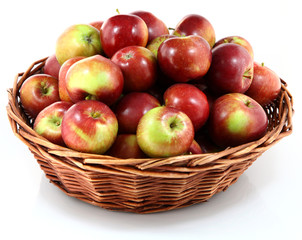 Naklejka na ściany i meble Basket with red apples on white background