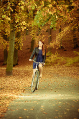 Obraz premium Girl in dress on bike.