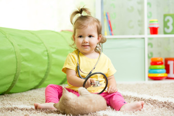 Child Girl Playing Doctor With A Cat