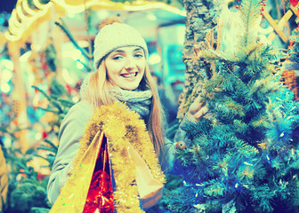 Portrait of young smiling woman at Christmas fair