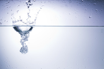 Clear water on a monochromatic background, abstraction