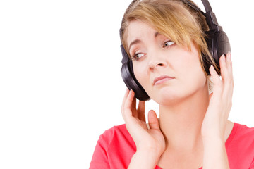 Fototapeta premium Woman sad girl in big headphones listening music