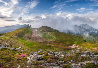 Fototapeta na wymiar Mountain Landscape with Peaks and Clouds