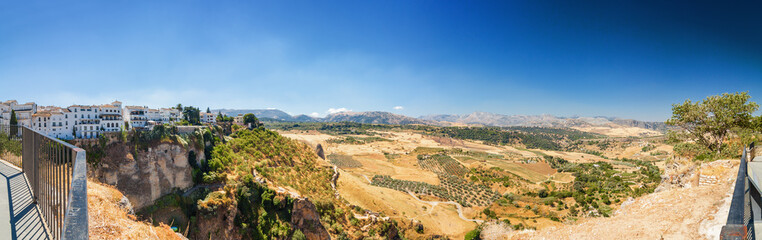 Fototapeta na wymiar Sunny panoramic view of fields near Ronda, Andalusia province, Spain.