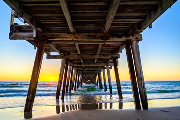 Sunset at Henley Beach viewed from under the jetty