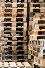 stack of wooden pallets in storehouse