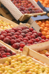 Counter with fruit in wooden boxes, background