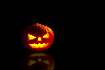 Pumpkin, Halloween pumpkin lantern, Pumpkin jack o lantern shiny head on black background.