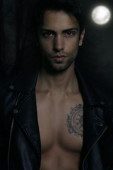 Sexy werewolf posing in a wood 