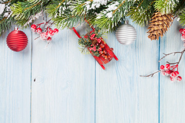 Christmas wooden background with fir tree and decor