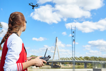 Woman playing with drone