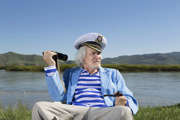 Captain looks through binoculars