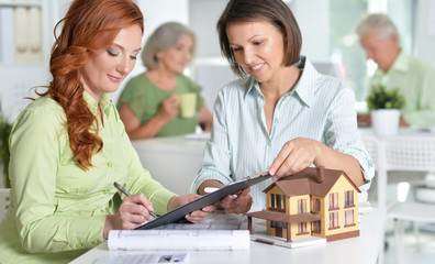  Female house agent and customer 