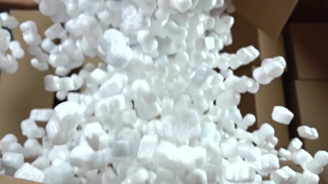 Falling soft polystyrene pieces. Shockproof packaging material. Safety and security concepts. Super slow motion shot