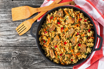Homemade prepared paella with meat, pepper, vegetables