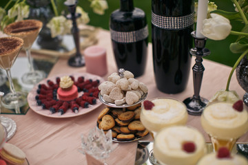 Cookies in the form of hearts lie on the little steel dish