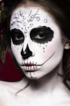 Woman in Halloween makeup - mexican Santa Muerte mask. Photos shot in studio