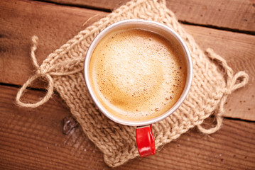 coffee in unusual vintage tin mug with red handle