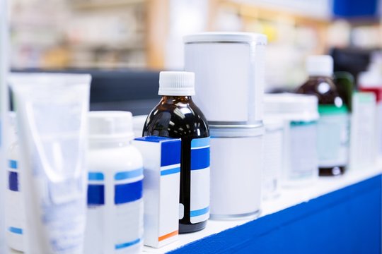 Various Boxes And Bottles Of Medicine On Table