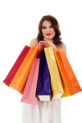 Young woman holding small empty shopping bags