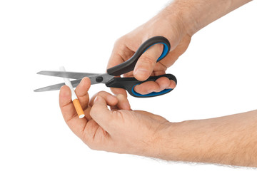 Hand with scissors and cigarette