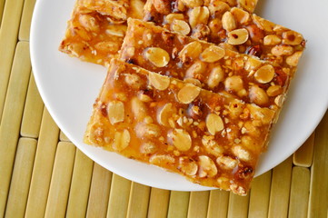 sweet peanuts stick on dish