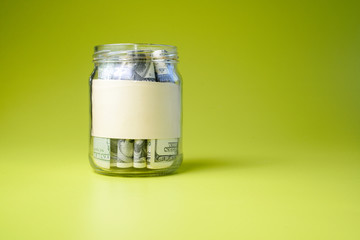 Bank of dollars on green background. copy space
