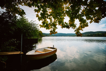 Naklejka na ściany i meble Peaceful atmosphere lake,boats and pier