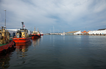 tugboats moored in port, nobody inside