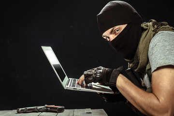 Terrorist working on his computer